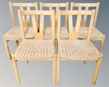 A Continental set of five dining chairs with rush seats