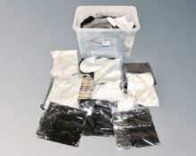 A box of lady's clothing, dresses, skirts, blouses, tagged as new.