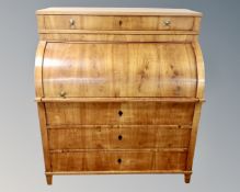 A 19th century Scandinavian satinwood barrel fronted bureau