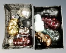 A box of glass and plastic skull ornaments