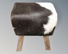 A contemporary stool in cow hide