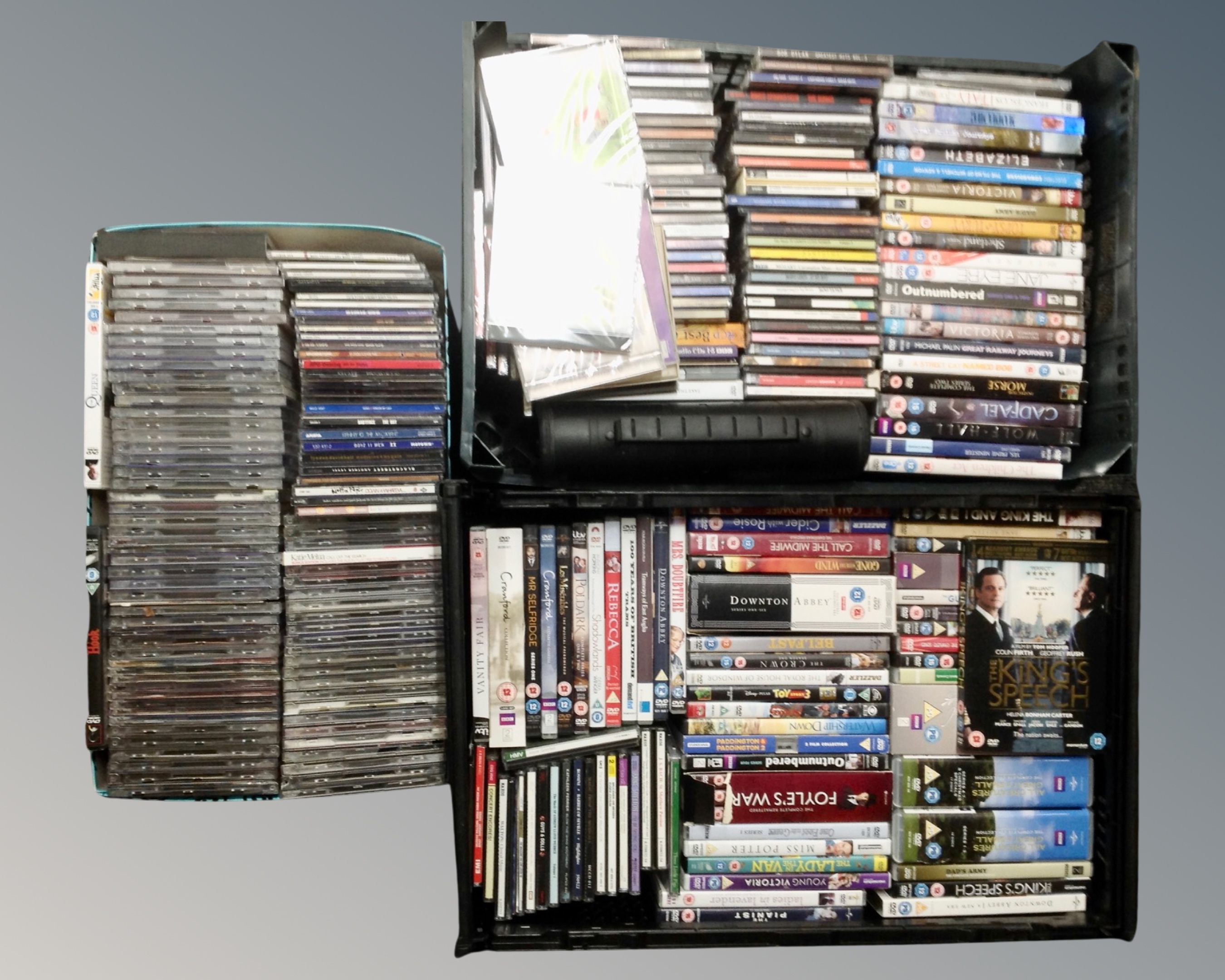 Three crates of assorted CD's and DVD's,