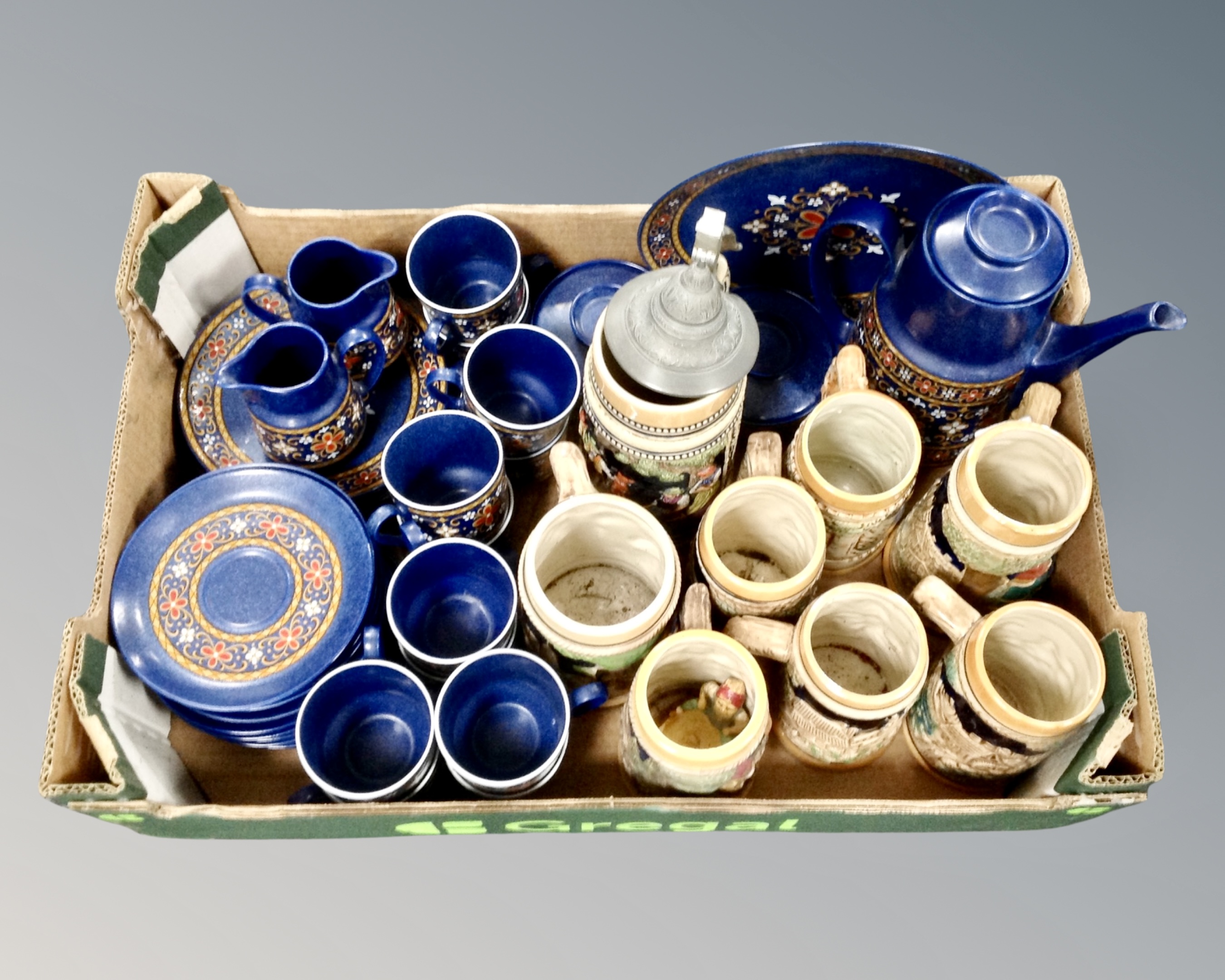 A box of West German pottery coffee set and beer steins