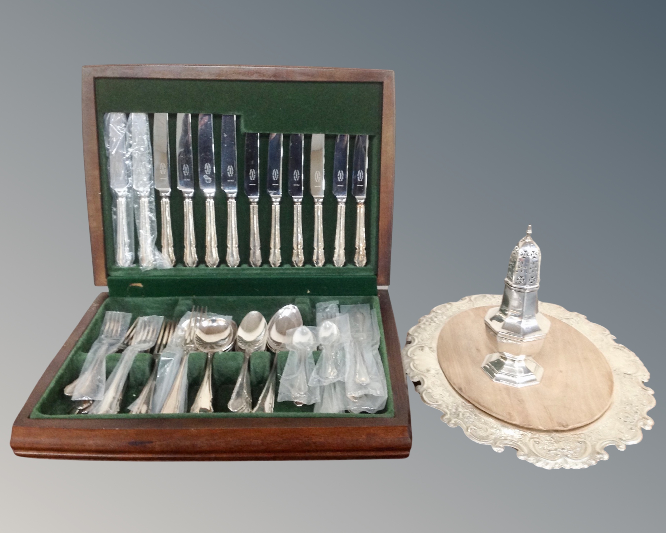 A canteen of George Butler plated cutlery together with a further plated sugar sifter and chopping