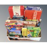A box of vintage board games, monopoly, tank battle etc.