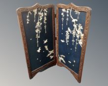 A Japanese two way folding fire screen with Shibayama inlay and lacquered reverse,