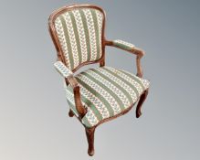 A Continental carved beech tapestry upholstered chair