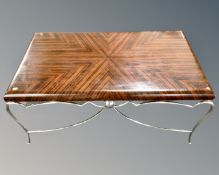A contemporary Art Deco style coffee table on chrome legs