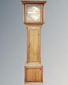 A 19th century longcase clock in oak case, brass dial signed J Winstanley, pendulum,