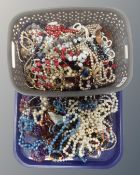 A tray of assorted costume jewellery and beaded necklaces etc