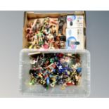 Two crates of assorted action figures, Lego and other plastic building blocks,