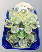 A collection of uranium glass and pressed green glass,