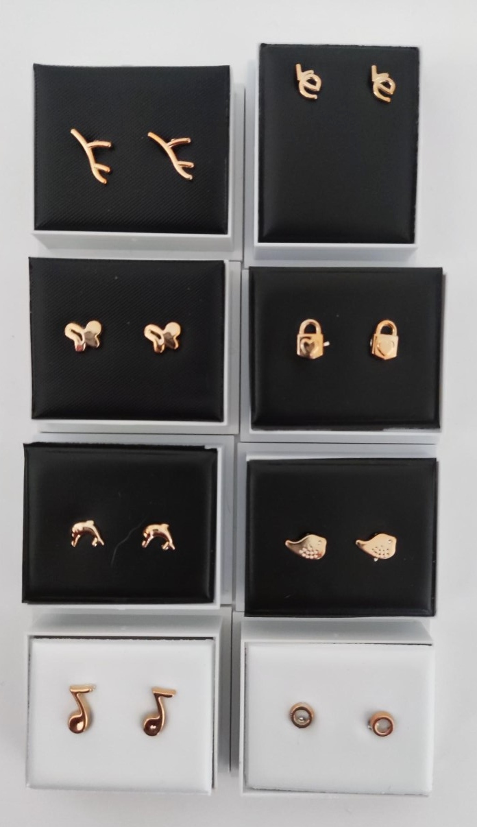 8 boxed pairs of gold plated earrings.