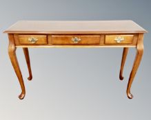 A contemporary three drawer console table on cabriole legs CONDITION REPORT: