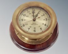 A brass reproduction nautical clock