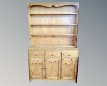 A pine kitchen dresser with plate rack CONDITION REPORT: height 185 cm x width 112