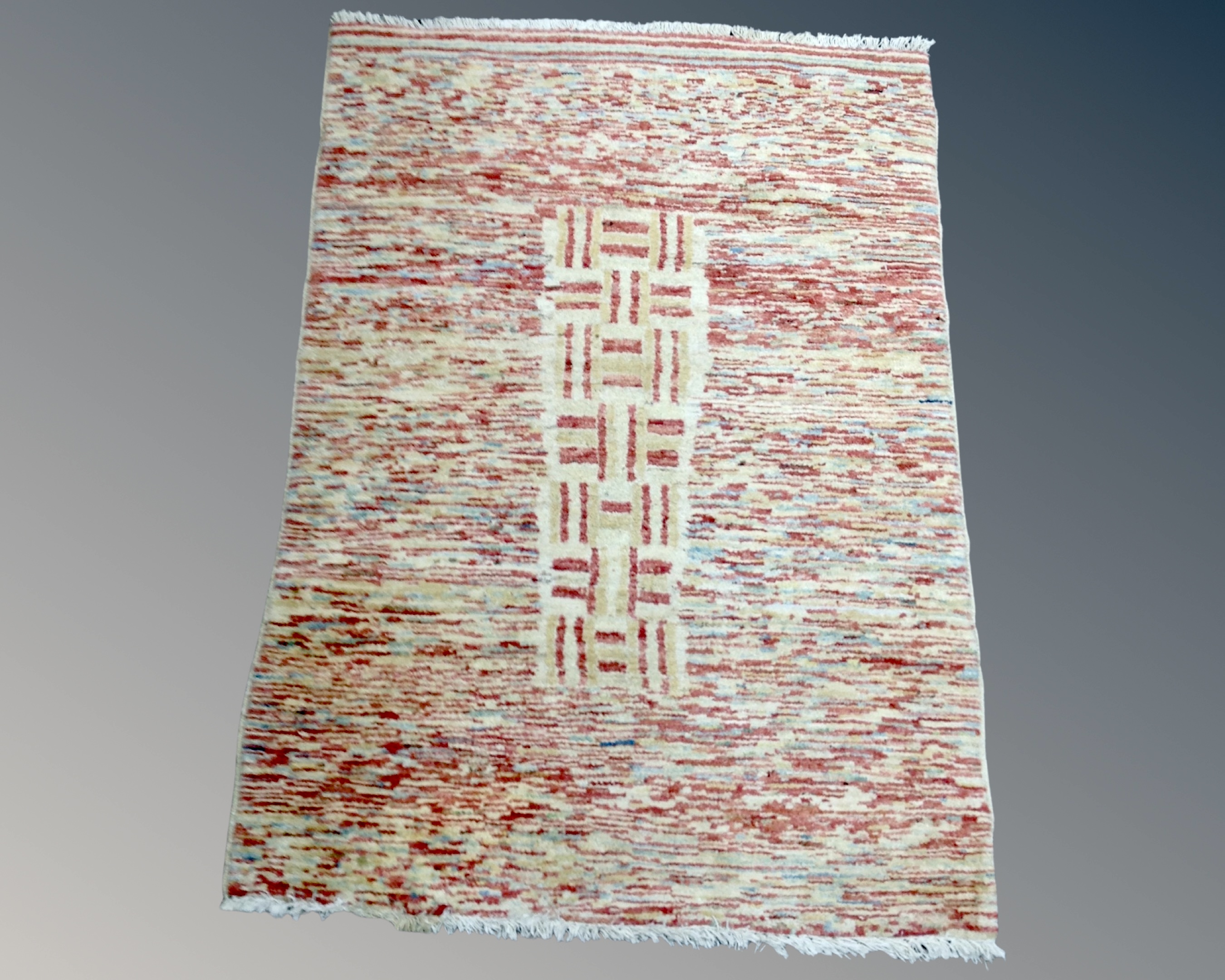 An eastern polychrome rug, 151cm by 104cm.