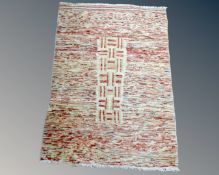 An eastern polychrome rug, 151cm by 104cm.