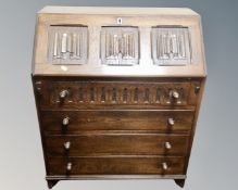 An Old Charm oak linen fold bureau