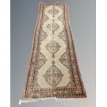 An antique Melas runner, West Anatolia, circa 1900, 305cm by 100cm.