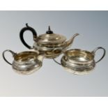A silver harlequin three-piece tea service, the teapot John Batt & Co Ltd, Sheffield 1930,