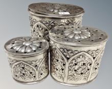 A silver plated graduated set of tins