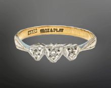 A 18ct gold and platinum three-stone diamond ring, size CONDITION REPORT: 1.