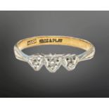 A 18ct gold and platinum three-stone diamond ring, size CONDITION REPORT: 1.