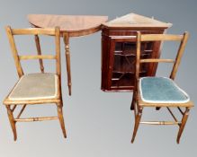 A pair of stained beech bedroom chairs together with a glazed door hanging corner cabinet and a