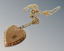 A heart shaped locket on rolled gold chain