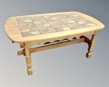 A Danish blonde oak tiled coffee table