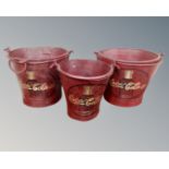 A set of three graduated painted metal buckets 'Coca Cola'