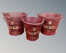 A set of three graduated painted metal buckets 'Coca Cola'
