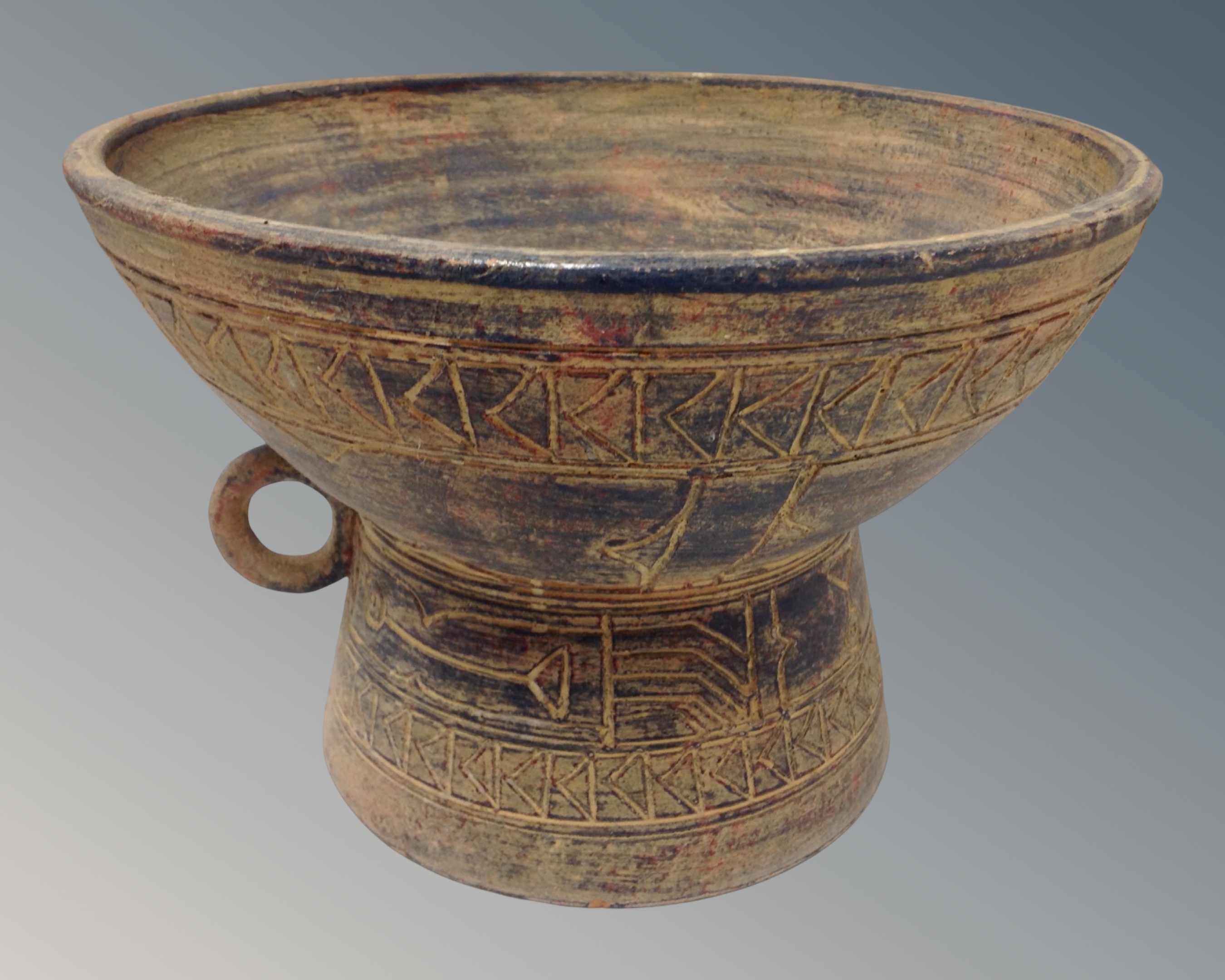 A studio pottery bowl of Aztec design