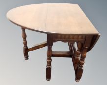 An Old Charm oak drop leaf table