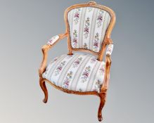 A Continental carved beech tapestry upholstered chair