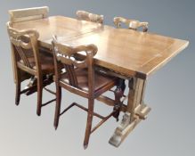A contemporary oak refectory dining table and set of four 1930's oak dining chairs