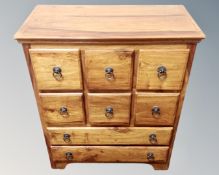 A mango wood eight drawer chest