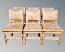A set of six Continental light oak dining chairs in studded tan leather