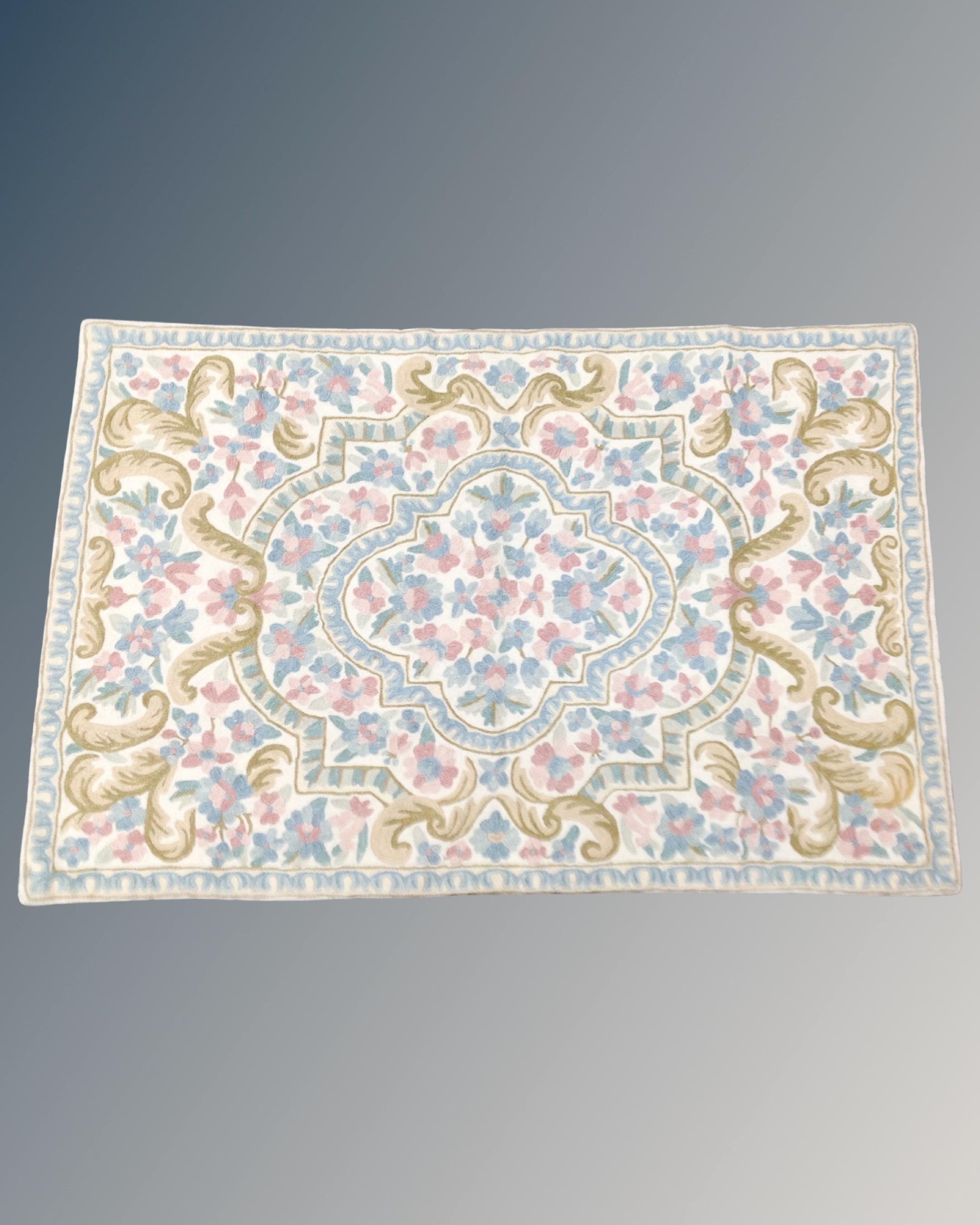 A Kashmiri stitch wool rug 91 cm x 60 cm