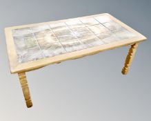 A Scandinavian blond oak tile topped coffee table