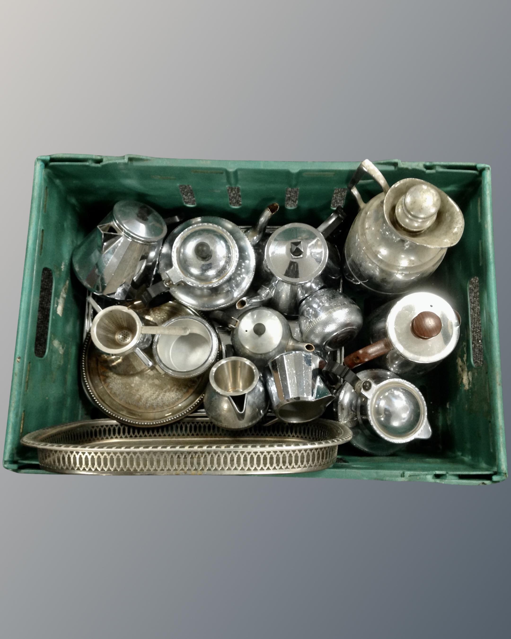 A basket of 20th century plated and chrome tea ware