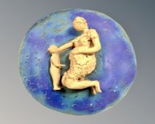 A contemporary studio ware panel depicting a mother with child,