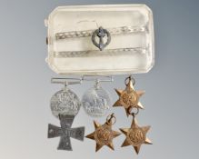 A perspex cigarette case together with a German Iron Cross and five British WWII medals