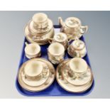 A twenty-one piece Japanese Satsuma earthenware tea service,
