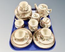 A twenty-one piece Japanese Satsuma earthenware tea service,