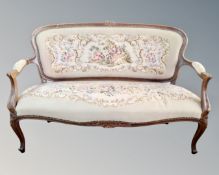 A Continental beech embroidered three seater salon settee