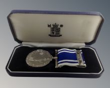 A Royal Mint police long service and good conduct medal on ribbon