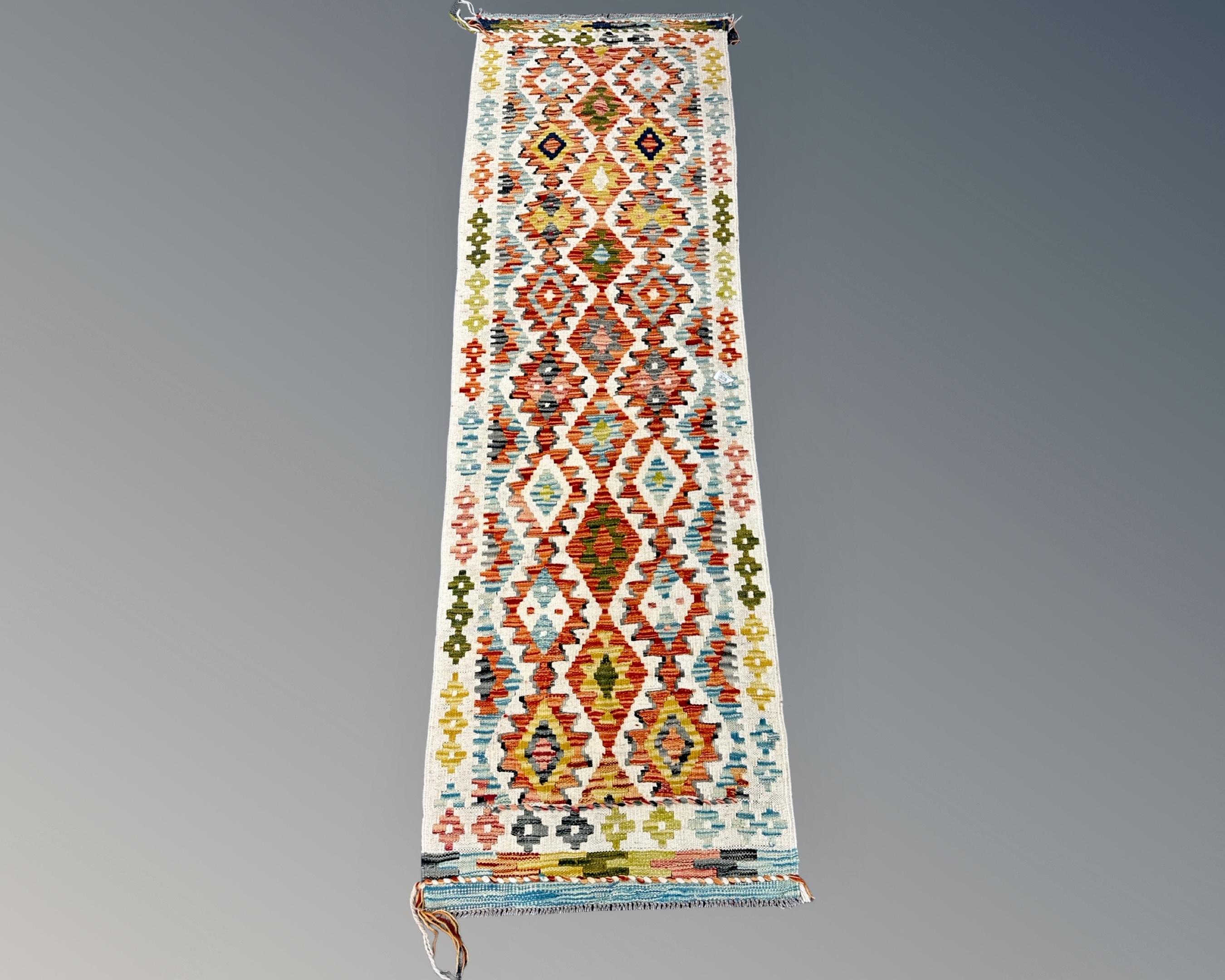 A Chobi Kilim Runner, 193cm by 63cm.