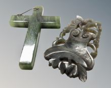 A jade crucifix pendant together with further jade carving.